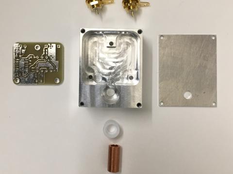 The disassembled components for a Faraday sensor box.