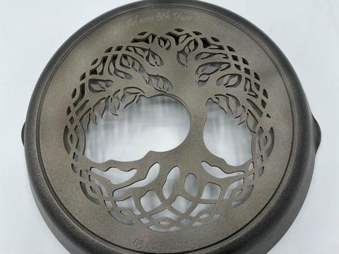 A Celtic tree design cut from a cast iron skillet.